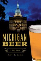 Book cover of Michigan beer: a heady history shows the Michigan capital bulding at night and a glass of beer.