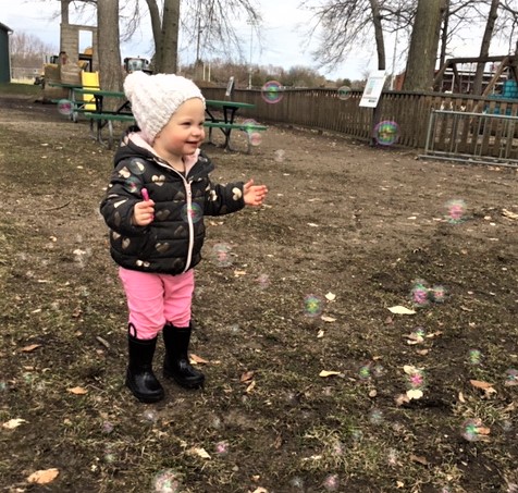 Toddler catching bubbles 1, cropped.jpg