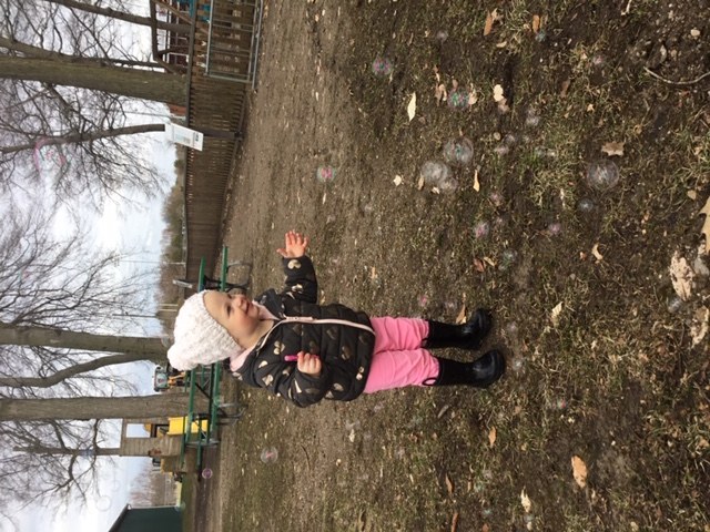 Toddler catching bubbles 2.JPG